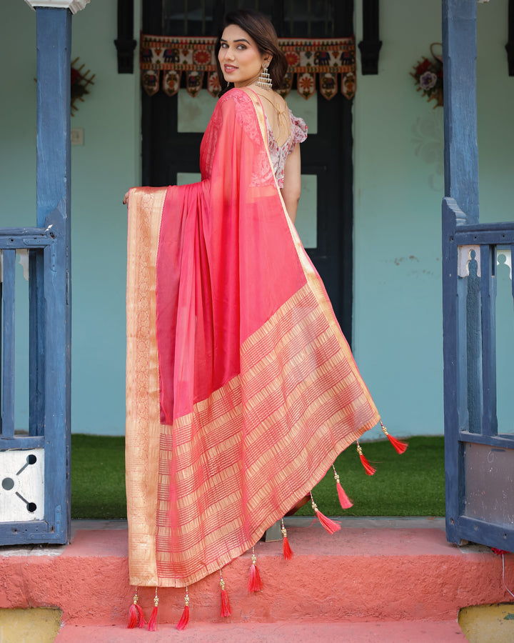 Vibrant Coral Pink Plain Chiffon Saree with Gold Zari Border Floral Ruffled Blouse & Tassel Detailing CHIFFON H 128-132