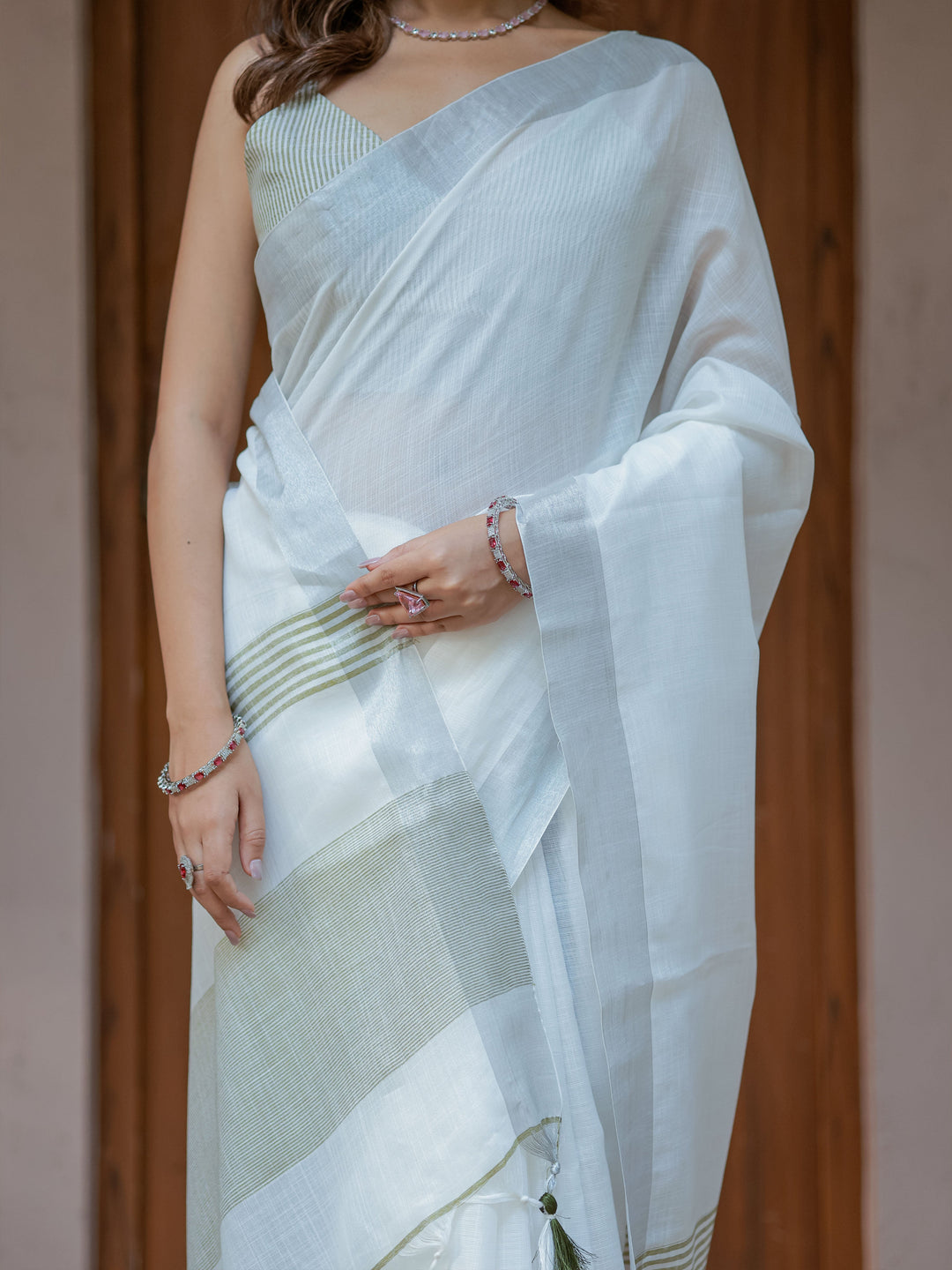 Pure White & Olive Green Handloom Cotton Saree with Minimal Striped Border & Tassel Detailing