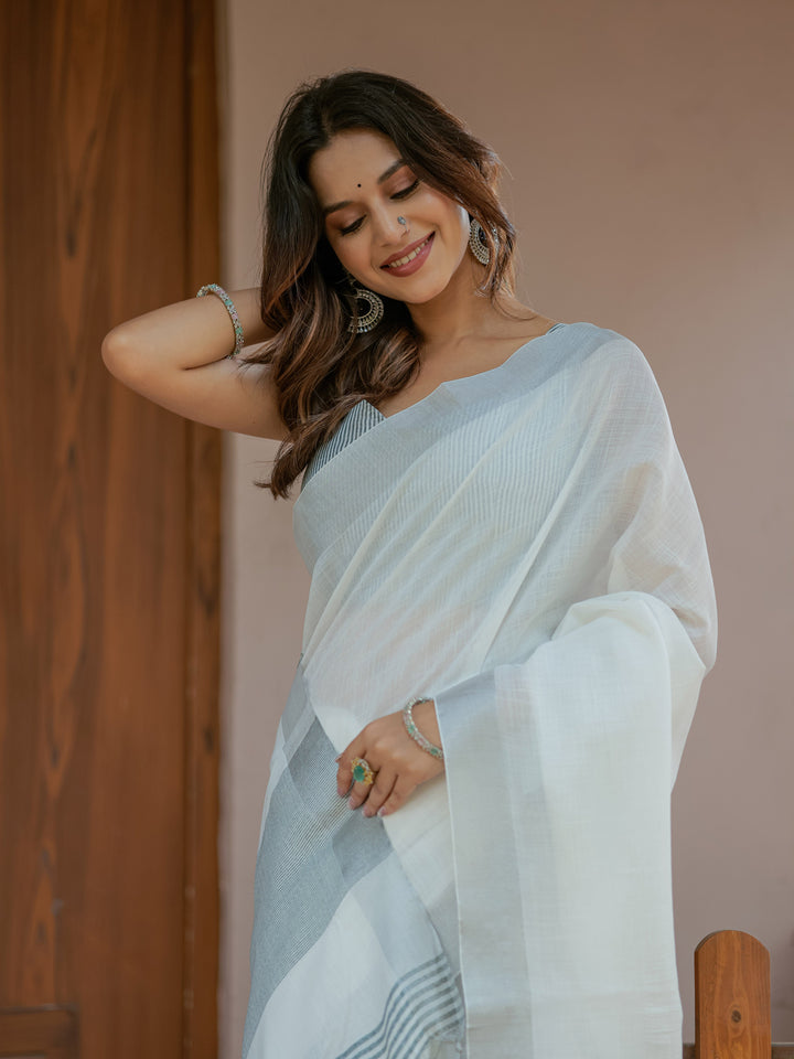 Pure White & Teal Blue Handloom Cotton Saree with Minimal Striped Border & Tassel Detailing