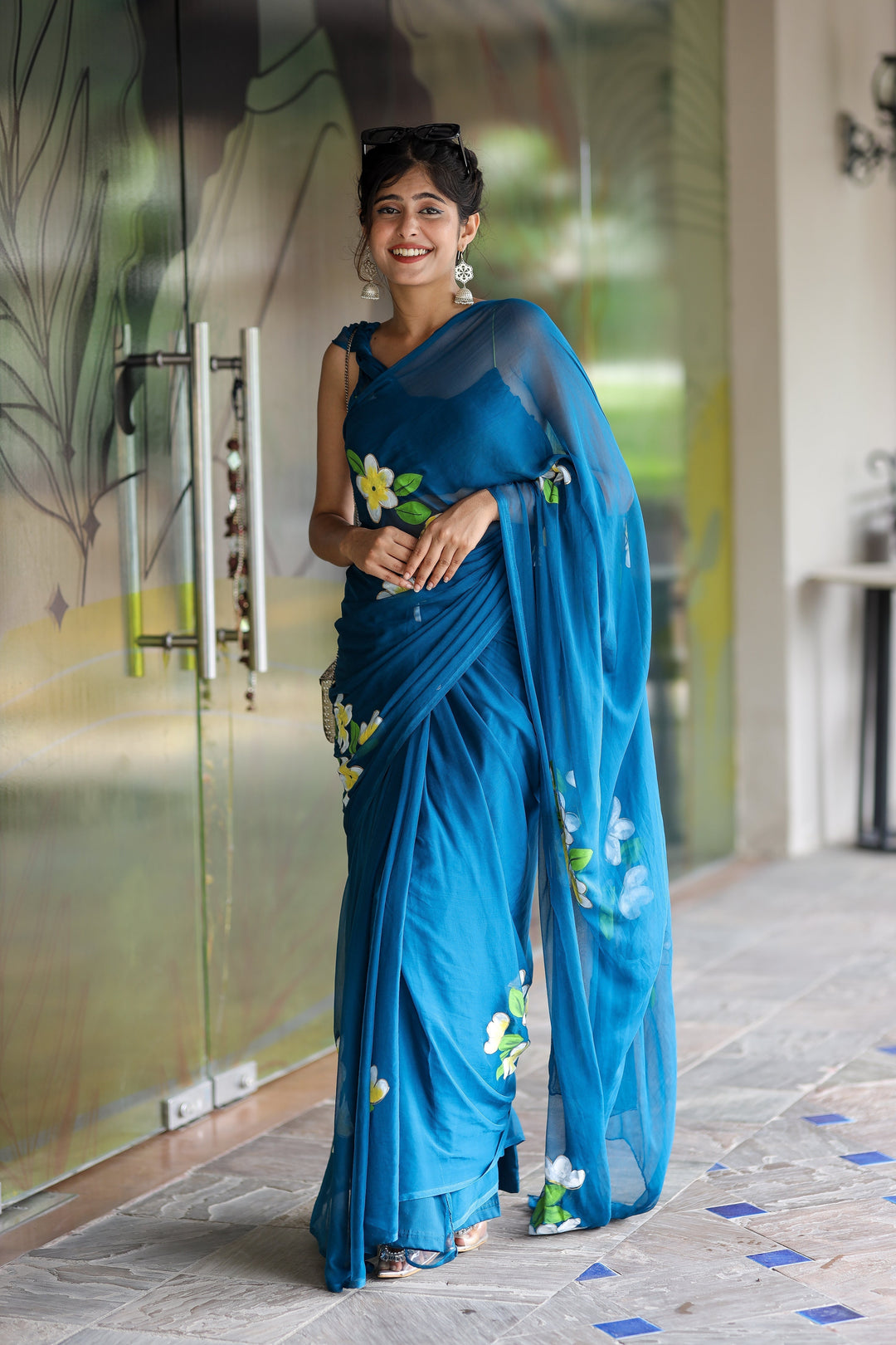 Teal Blue Georgette Saree with Hand-Painted Yellow & White Floral Motifs – Attached Blouse – 5.5 Meters