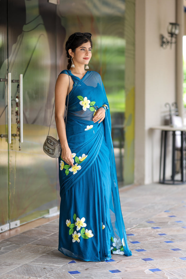 Teal Blue Georgette Saree with Hand-Painted Yellow & White Floral Motifs – Attached Blouse – 5.5 Meters