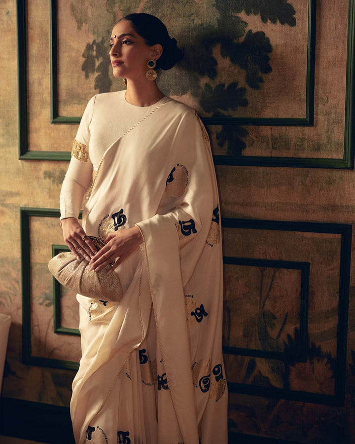 SONAM KAPOOR In Cream Satin Georgette Saree with Golden and Black Calligraphy Print