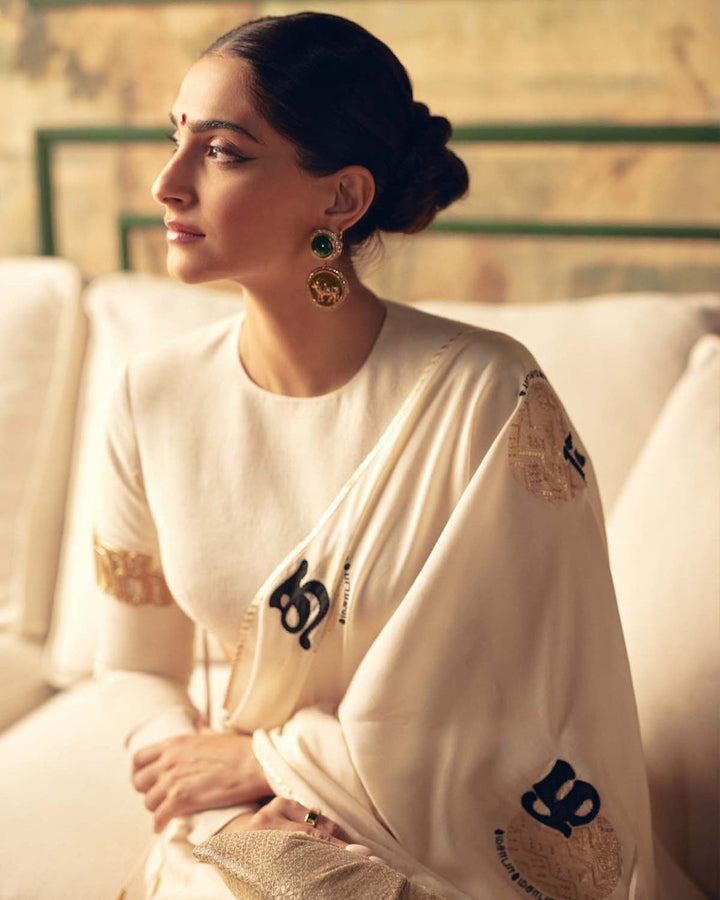 SONAM KAPOOR In Cream Satin Georgette Saree with Golden and Black Calligraphy Print