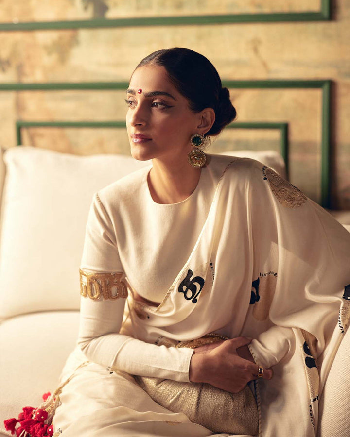 SONAM KAPOOR In Cream Satin Georgette Saree with Golden and Black Calligraphy Print