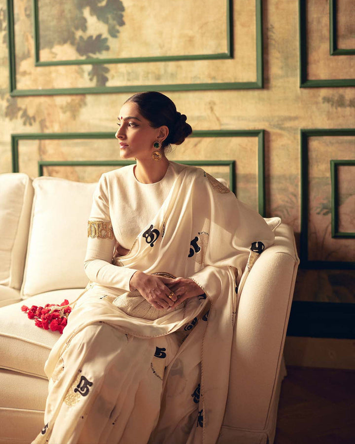SONAM KAPOOR In Cream Satin Georgette Saree with Golden and Black Calligraphy Print