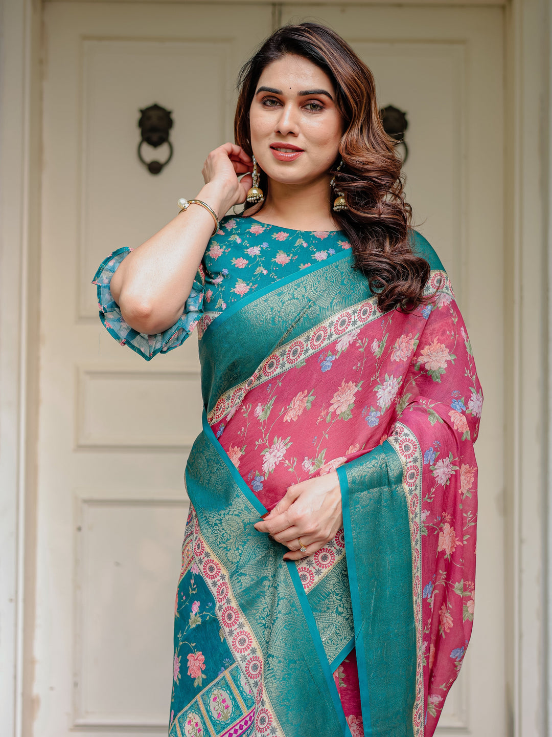 Rani Pink & Teal Green Floral Printed Saree with Rich Zari Border & Tassels – Festive Traditional Wear