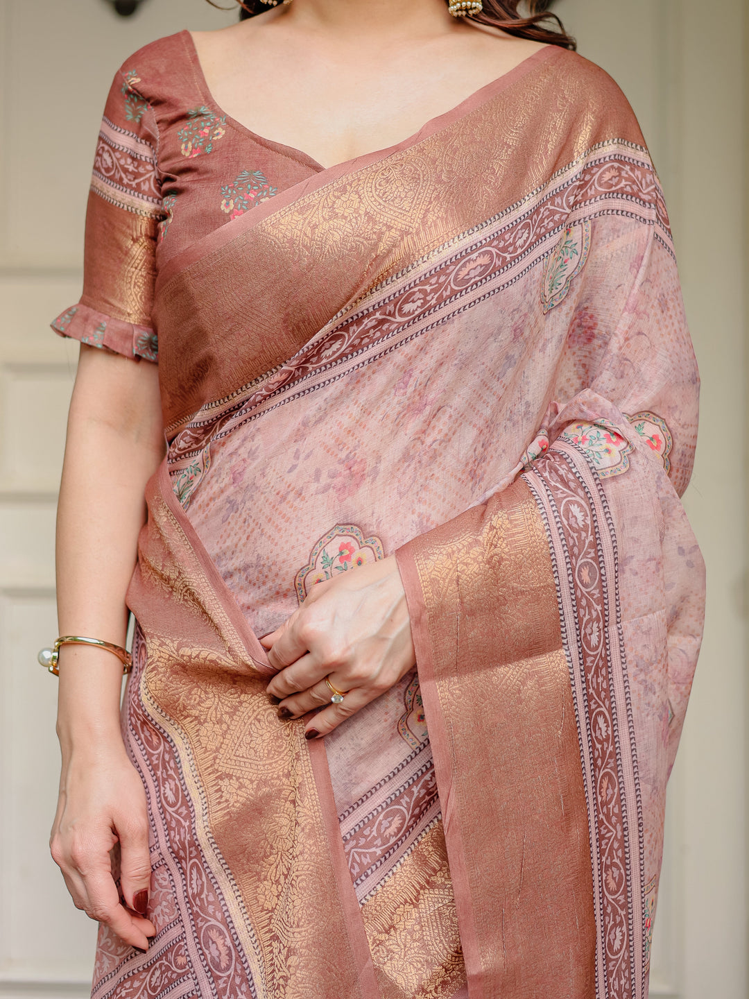 Dusty Peach & Copper Zari Woven Saree with Pastel Motifs & Tassels – Elegant Festive Traditional Wear