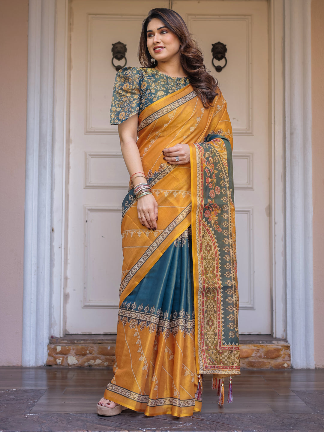 Mustard Yellow & Teal Green Floral Panel Printed Handloom Cotton Saree with Heritage Border & Tassels – Festive Traditional Wear