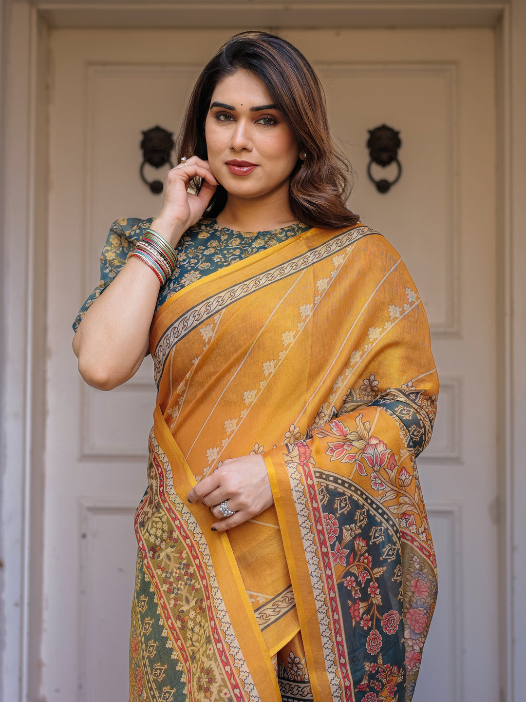 Mustard Yellow & Teal Green Floral Panel Printed Handloom Cotton Saree with Heritage Border & Tassels – Festive Traditional Wear