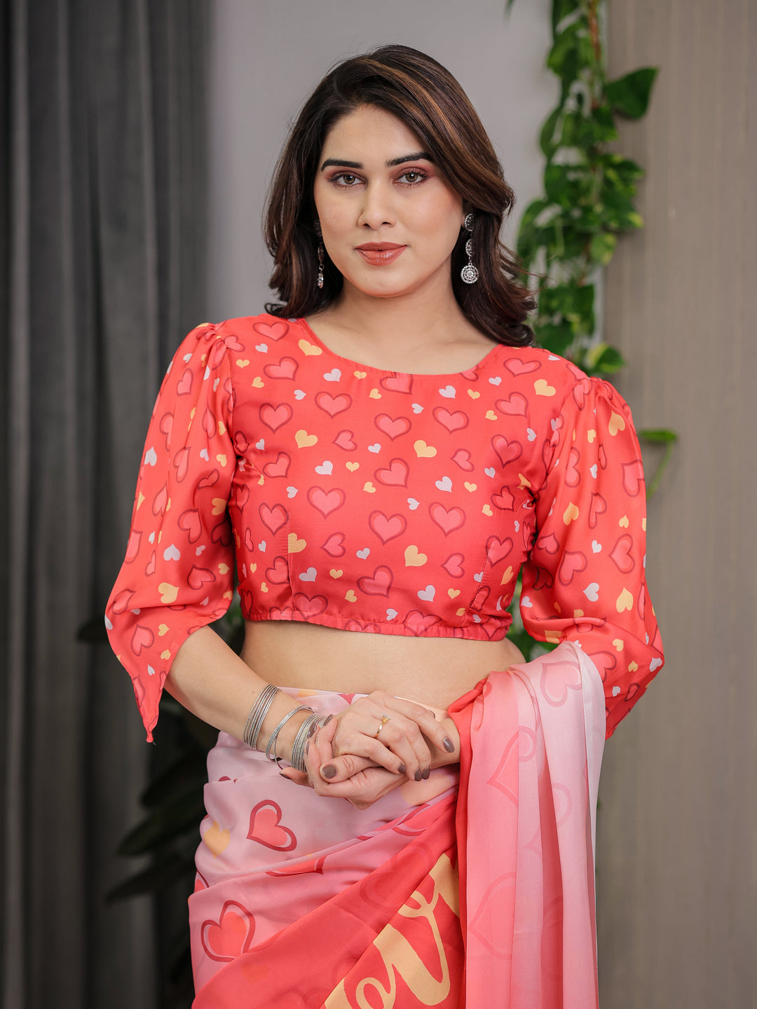 Coral Red & Blush Pink Heart Printed Satin Georgette Saree with Romantic Couple Pallu and Attached Heart Print Blouse – 5.5 Meter Designer Saree for Valentine’s Day & Anniversary Wear