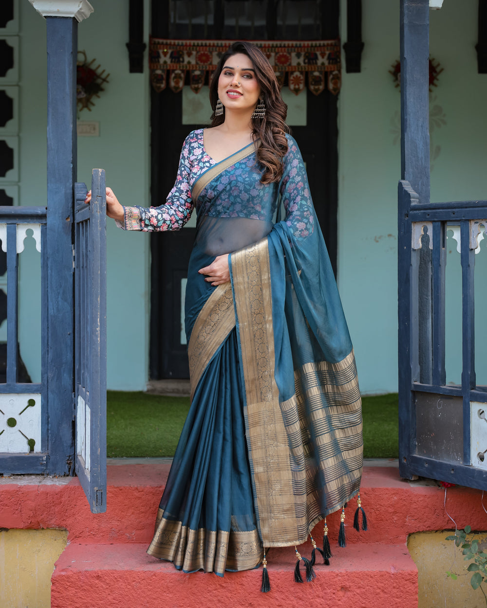Teal Blue Plain Chiffon Saree with Gold Zari Border Floral Printed Blouse & Tassel Detailing CHIFFON H 128-132