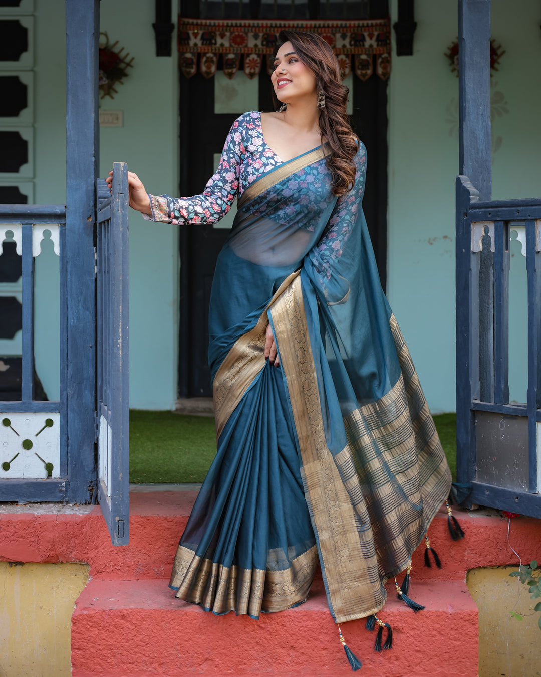 Teal Blue Plain Chiffon Saree with Gold Zari Border Floral Printed Blouse & Tassel Detailing CHIFFON H 128-132