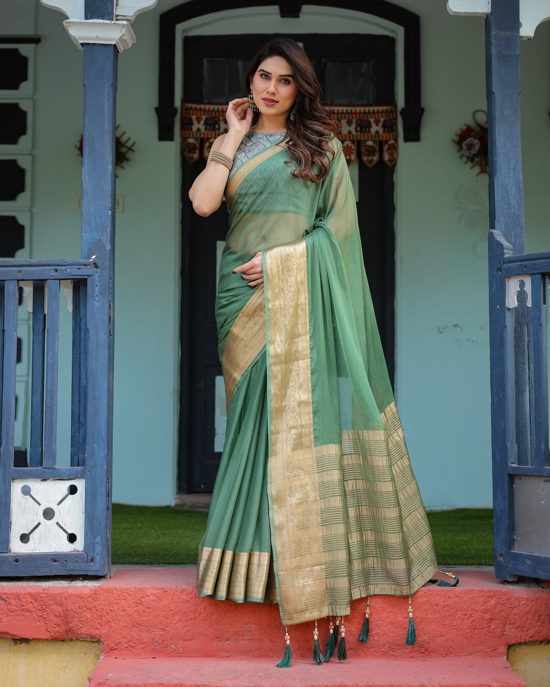 Mint Green Plain Chiffon Saree with Gold Zari Border Geometric Printed Blouse & Tassel Detailing CHIFFON H 128-132