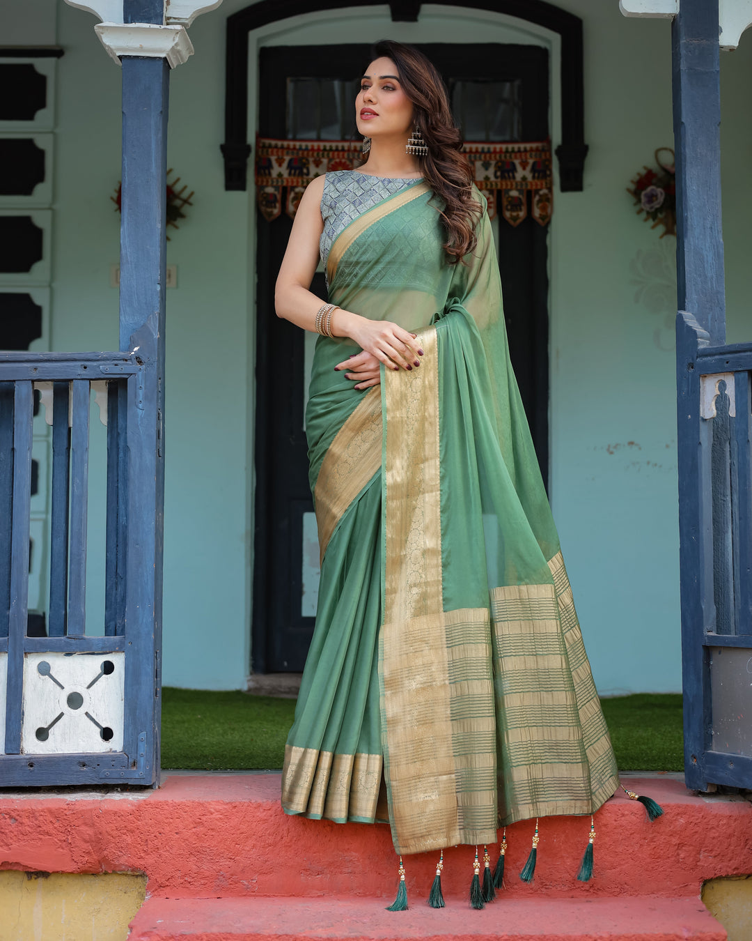 Mint Green Plain Chiffon Saree with Gold Zari Border Geometric Printed Blouse & Tassel Detailing CHIFFON H 128-132