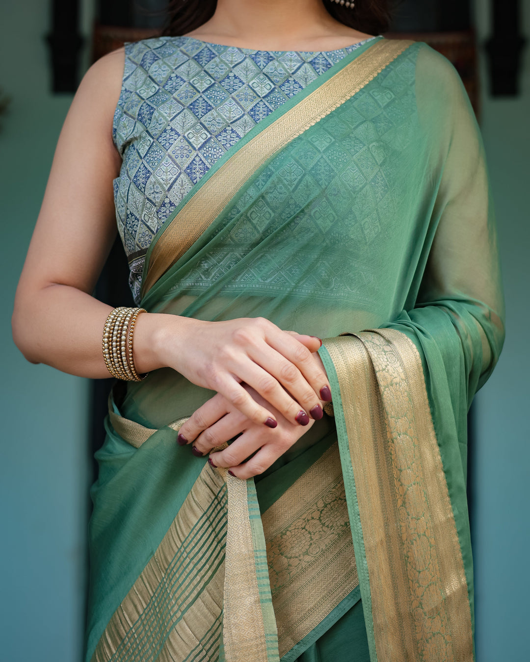 Mint Green Plain Chiffon Saree with Gold Zari Border Geometric Printed Blouse & Tassel Detailing CHIFFON H 128-132