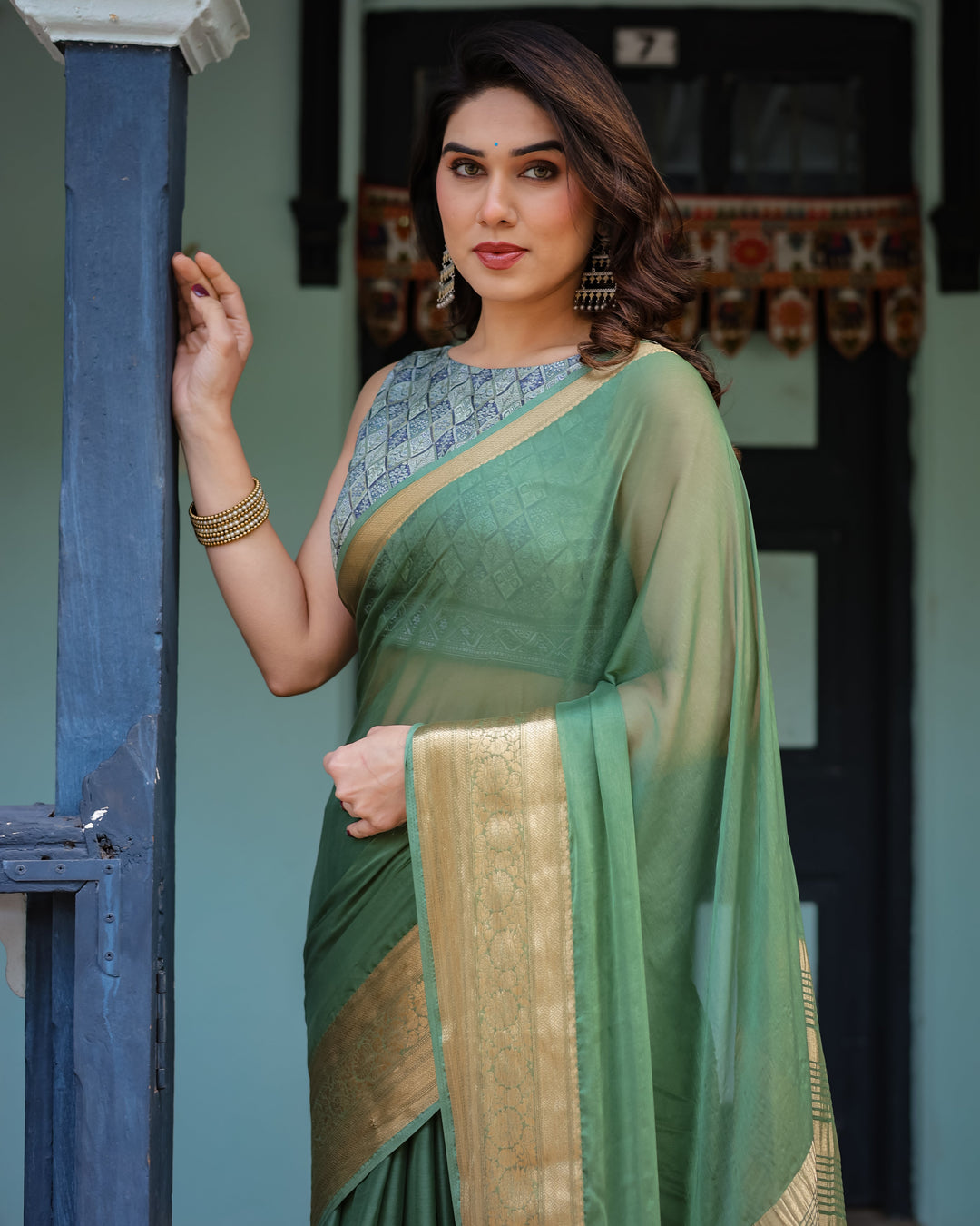 Mint Green Plain Chiffon Saree with Gold Zari Border Geometric Printed Blouse & Tassel Detailing CHIFFON H 128-132
