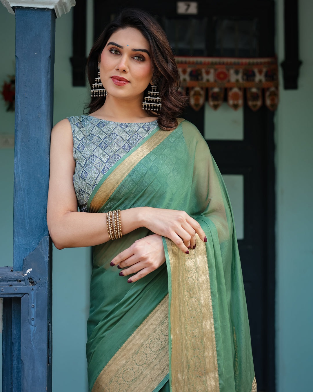Mint Green Plain Chiffon Saree with Gold Zari Border Geometric Printed Blouse & Tassel Detailing CHIFFON H 128-132