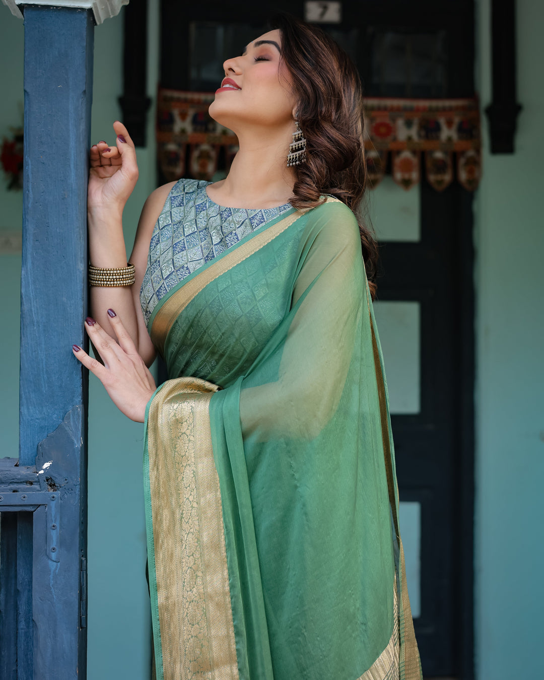 Mint Green Plain Chiffon Saree with Gold Zari Border Geometric Printed Blouse & Tassel Detailing CHIFFON H 128-132