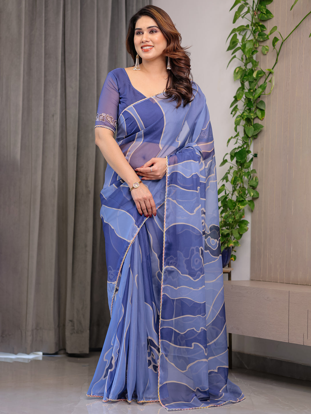 Elegant Steel Blue Printed Organza Saree with Abstract Wave Motifs & Multicolour Lace Border | Designer Lightweight Organza Saree with Attached Blouse Piece | Contemporary Festive Wear Saree