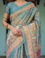 Turquoise Blue Handloom Cotton Saree with Multicolor Floral Pallu & Peach Border