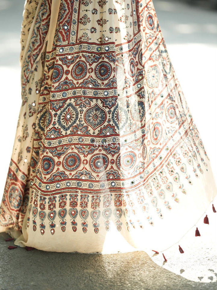 Ivory Modal Silk Ajrakh Printed Saree with Traditional Floral Motifs, Heritage Border & Tassel Detailing