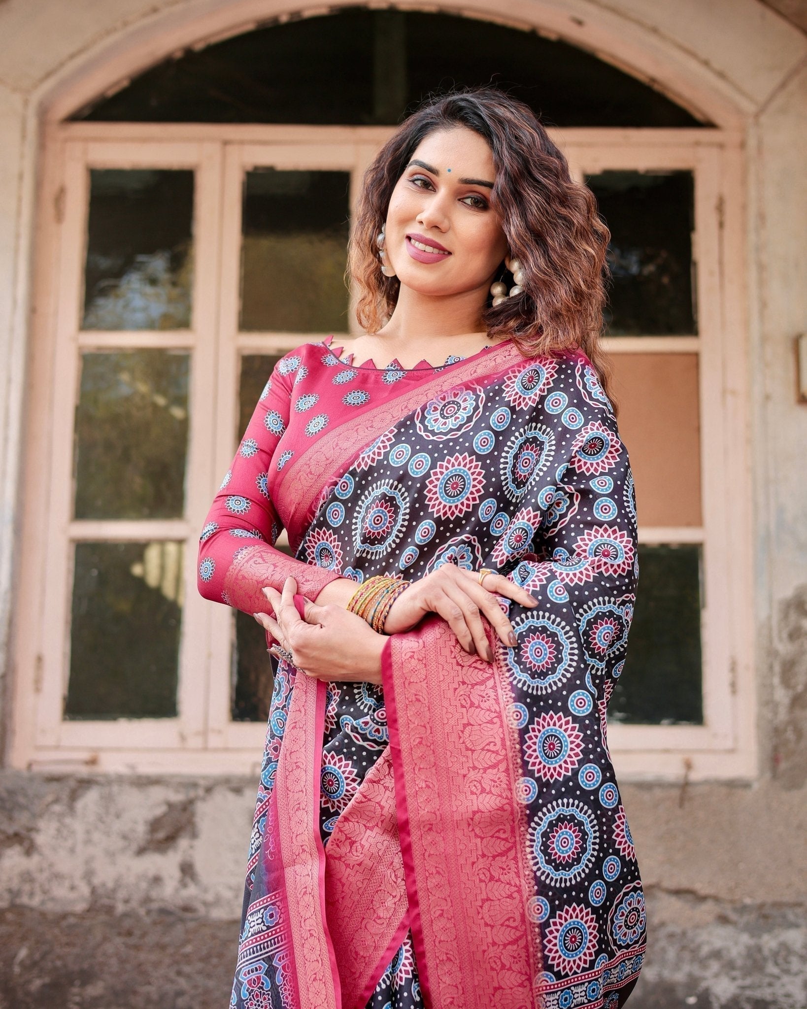 Black and Coral Tussar Silk Saree with Intricate Circular Motifs and Ornamental Pallu